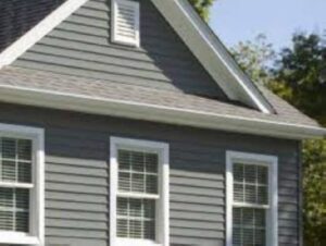 A house with two windows and a roof.