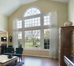 A living room with two windows and a table