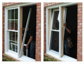 A person is holding onto the window frame