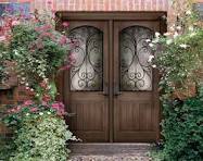 A double door with two wrought iron doors.