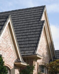 Roofs with brick wall and cloudy sky.