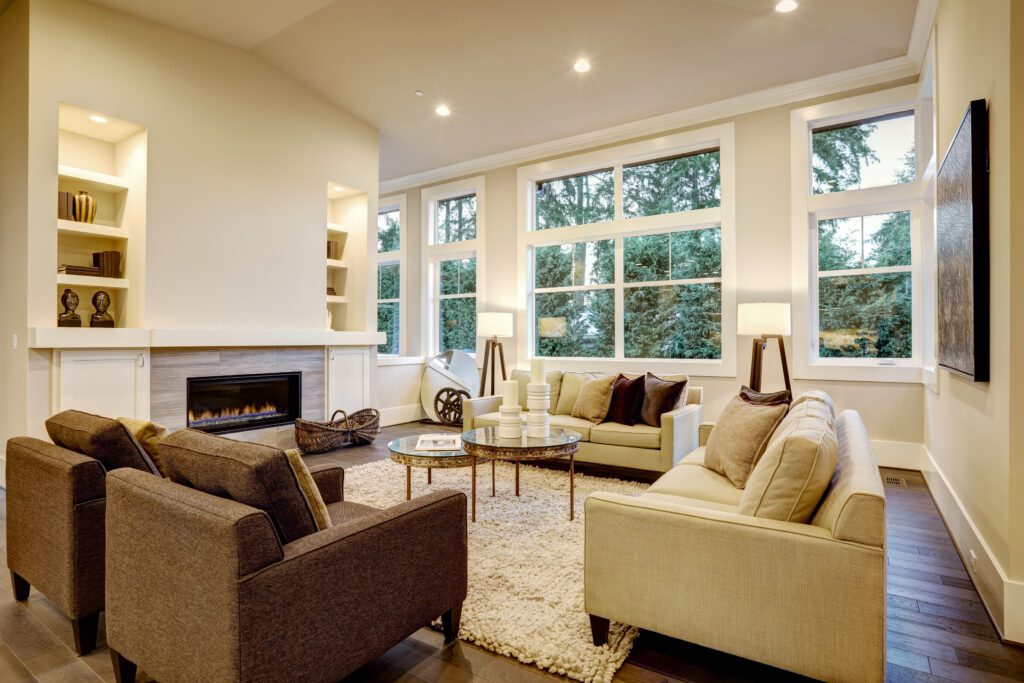 Cozy modern living room with large windows.