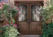 A double door with two wrought iron doors.